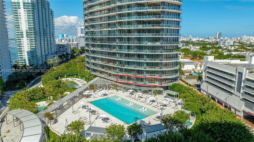 Experience elevated waterfront living at Five Park Miami Beach, South of Fifth’s newest luxury landmark. This rare 1BR + Den / 1.5BA residence offers 1,110 SF plus terrace and is one of only four lines in the building featuring a unique 2-bedroom-style layout with direct bay-facing sunset views overlooking the resort-style pool deck. Floor-to-ceiling glass fills the home with natural light, while the chef’s kitchen features premium Gaggenau appliances and elegant quartzite countertops. Residents enjoy world-class amenities including private beach club access, two pools and hot tub, spa, state-of-the-art fitness center, in-residence dining, butler service, two house cars, and direct access to the lush 3-acre Canopy Park. Exceptional opportunity to own in one of Miami Beach’s most sought-after new developments.