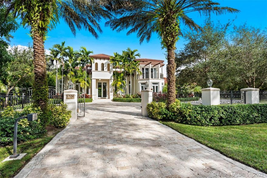Superlative Mediterranean Masterpiece located on a stunning corner lot in coveted North Pinecrest. Awing interior with a soaring 2-story entry hall, huge windows, wood and marble floors, refined finishes & details. 5 bedroom, 5/2 bath perfectly spread designed over 7,628 SqFt of living area. Formal living and dining rooms, oversize chef’s kitchen with two cooking islands, WOLF and Subzero appliances and pool views is an epicurean dream. A spectacular oasis with heated salt water pool, expansive gazebo and patio with full summer kitchen – impeccably designed for entertaining inside & out. Full home generator, elevator, basketball court and three car garage complete this Pinecrest home.