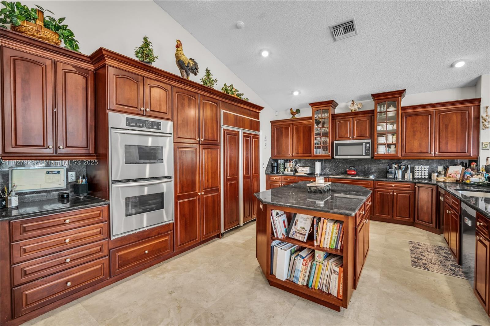 Beautiful estate home in the exclusive Whispering Woods gated community of Coral Springs. Featuring six spacious bedrooms plus a den, four full baths, and two half baths, this elegant home sits on a magnificent 50,460 SF lot. Enjoy marble floors throughout, a gourmet kitchen, and open living spaces that are perfect for family gatherings and entertaining. This house features ample windows that allow for plenty of natural light. The expansive backyard features a stunning pool, a large patio, and ample space to gather, relax, or play. A rare opportunity to own a serene retreat in a prestigious gated community. You will love it!!