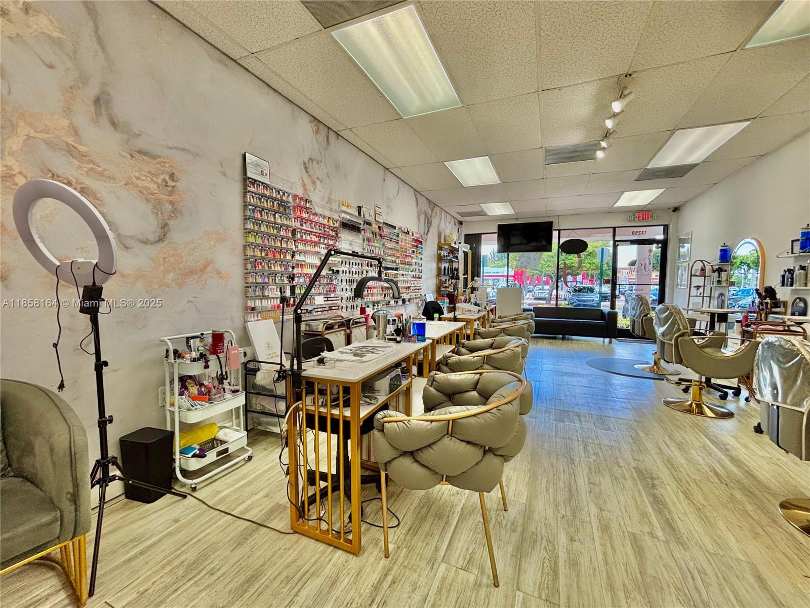 This modern, glam-inspired space is ready for immediate operation and offers everything you need to run a thriving business. Features - 6 Hair Stylist Stations,4 Manicure Stations & 3 Pedicure Stations,2 Wash Stations,1 Private Treatment Room. Fully renovated with high-end finishes, chic lighting, and elegant décor. Prime location with excellent visibility and foot traffic. Ample parking for clients and staff. This is an incredible opportunity for an entrepreneur or beauty professional to own a salon in a high-demand area. SELLER MOTIVATED! Bring your offers!