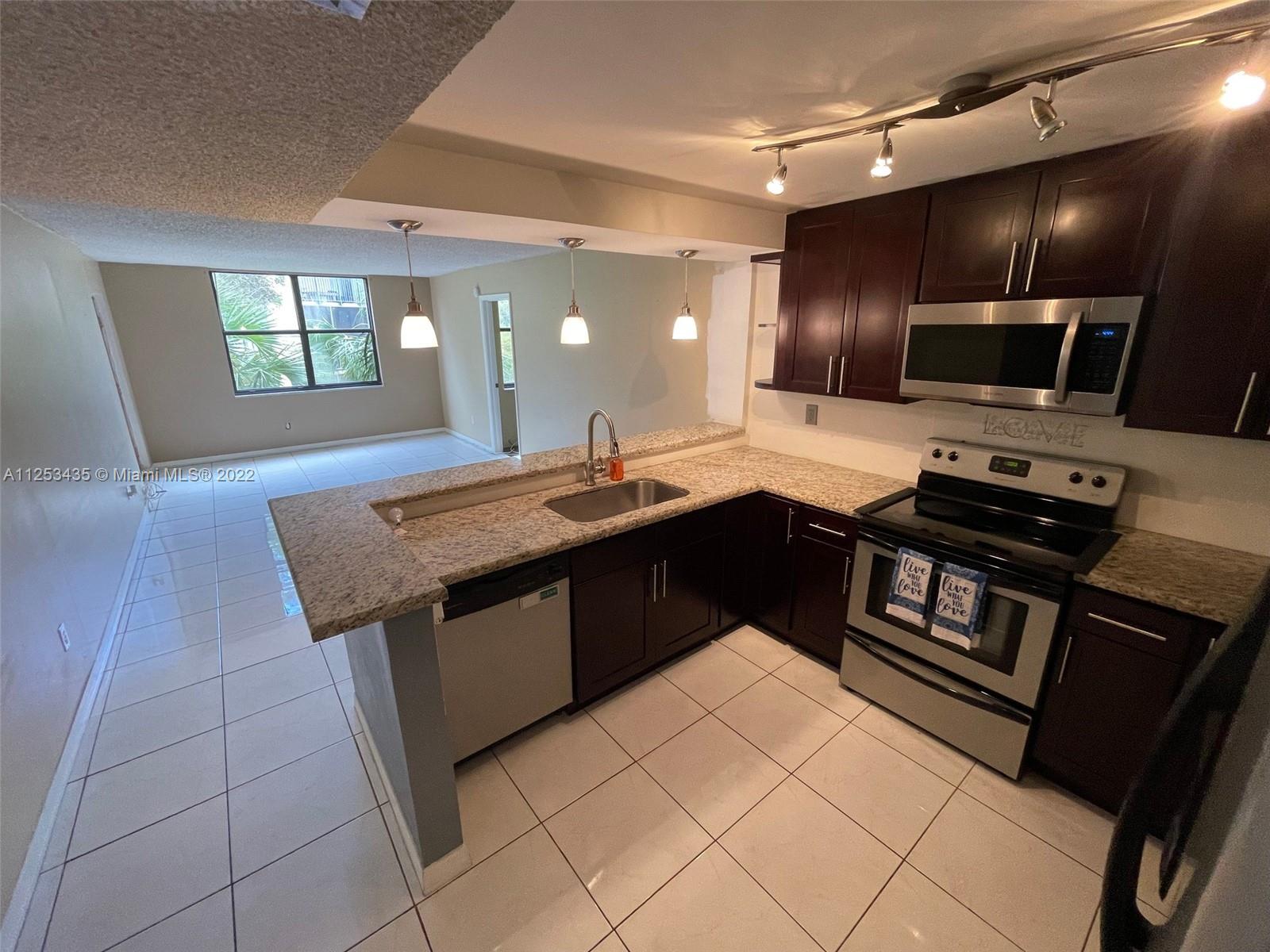 3/2 Condo in the heart of Kendall! This unit is located on the 3rd floor, corner overlooking common areas. The kitchen features granite countertops and wooden cabinetry. A/C handler was recently updated. Unit also features large balcony overlooking common areas with washer and dryer on placed on the patio behind double doors. There are (2) assigned spaces (781 + 782) for this unit. Guests can park in parking spaces marked "GUEST". Community consists of 13 buildings and 608 apartments, 2 clubhouses, 2 swimming pools and a tennis court. Community sits on small lake with walkway. Gated community with Security service. Property will be shown starting August 10th during open house.