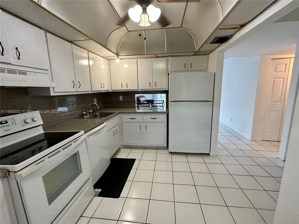 Photo of 3051 NW 46th Ave #203, Lauderdale Lakes, FL 33313 (MLS # A11688052)