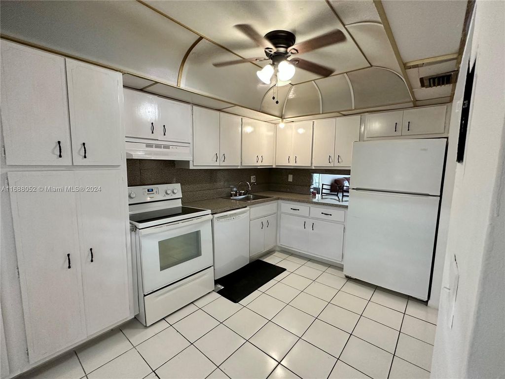Photo of 3051 NW 46th Ave #203, Lauderdale Lakes, FL 33313 (MLS # A11688052)