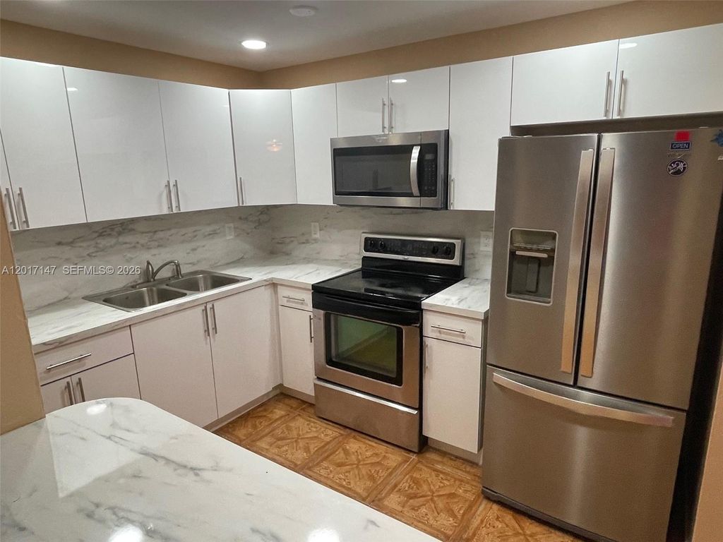 Photo of 5960 NW 20th St #5960, Lauderhill, FL 33313 (MLS # A12017147)