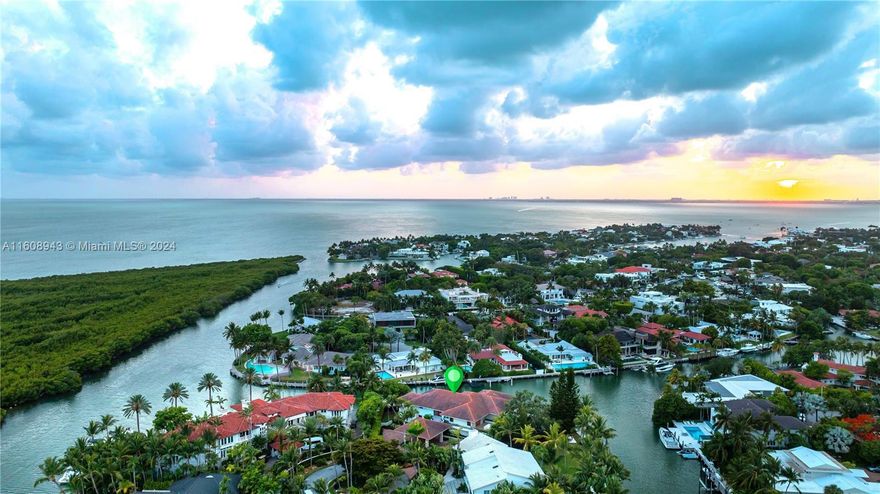 Spectacular Contemporary Home, located on Cape Florida Drive cul-de-sac, one of the highest land value in the island of Key Biscayne, over 1/2-acre lot, more than 250’ waterfront, private dock, boat lift, custom made pool, elevator, an elegant grand foyer entrance with an indoor botanical garden & electric sprinkler system, followed by a majestic unique custom design staircase by an iconic interior designer. This property of 8 Beds+8.5 baths is designed by a prestigious architect &built by Interscope features a solid foundation & Structure and a generator for the entire home. A unique design w/ guest suite, maids’ area, 5AC units, electric shutters on windows & doors, garage area has 2 covered+ 4 under a huge porte-cochere, +8 cars fit in paved driveway, 2 electric gates.