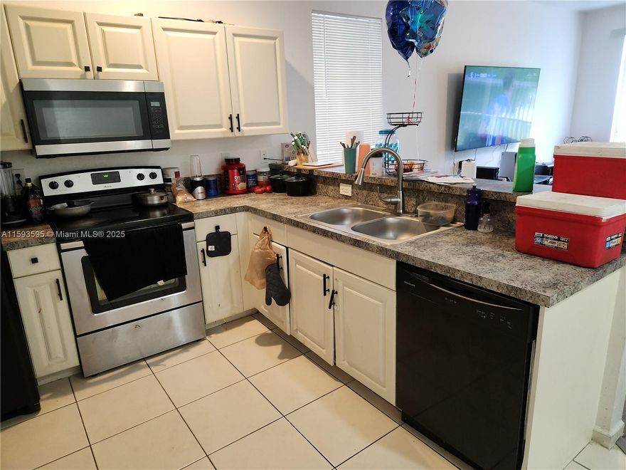 Great and spacious 2006 construction 3 bedrooms 2 bathrooms condo with private entry lobby at ground level and living areas in 2nd floor.  All appliances and washer and dryer included, even though they don't show in the pictures. Laminate waterproof simil wood vinyl flooring.  Leased at $1,900 until February 28th 2026 to a great tenant. Great gated complex, security onsite, very clean and well maintained. No wait for leasing, all ages welcome.  VIRTUAL TOUR VIDEO available upon request.  ***AGENTS SEE BROKER REMARKS***