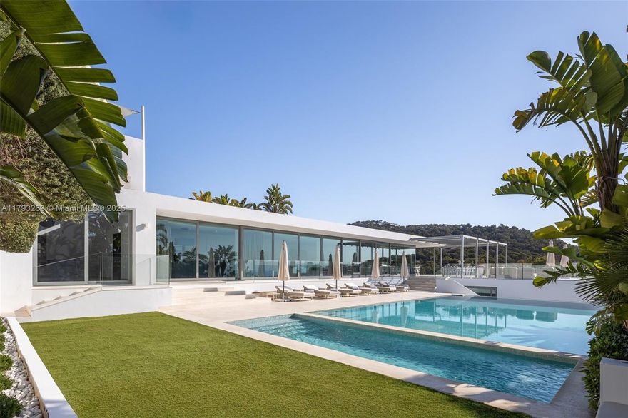 This marvellous property is truly breathtaking. Designed by world renowned architect Bruno Erpicum to capture the vibrancy, fun and natural beauty of Ibiza, not only will you be staying in a piece of iconic architecture but you’ll also be able to take advantage of one of the most luxurious locations on the island.
You’ll also experience possibly the best views on the island; wake up in this villa and you’ll be met by an unparalleled panorama – sun soaked vistas of the Mediterranean and island of Formentera.
Hidden within pine trees and fragrant gardens, this 850-square-metre (9,150-square-foot) on top of a plot of land of 1600m2, 8-bedroom villa opens to expansive outdoor terraces and gardens, including a private pool and Jacuzzi with views of the sea.