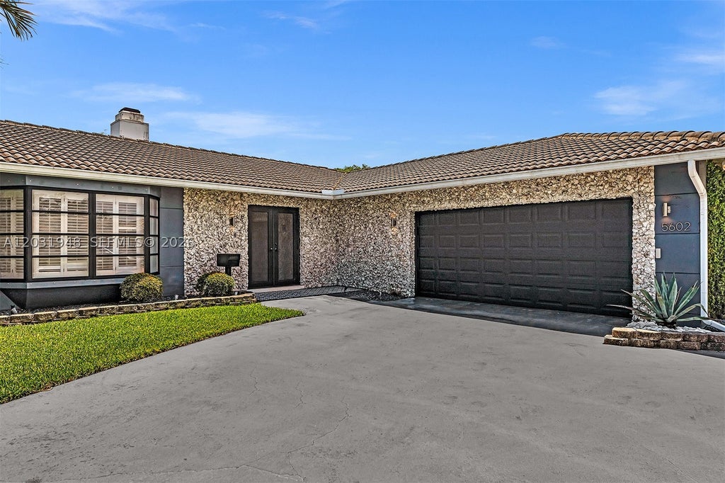 Photo of 5602 S Travelers Palm Ln, Tamarac, FL 33319 (MLS # A12031948)