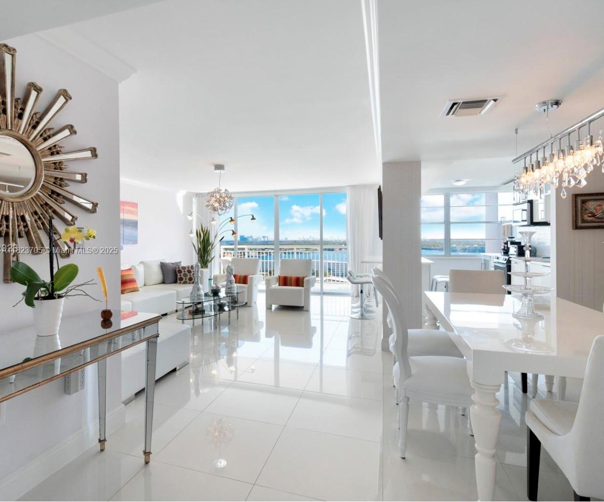 Amazing and spacious apartment in Del Prado on the Bay in Aventura! This fantastic corner unit offers semi-private elevator access and breathtaking waterfront views from two balconies. Fully renovated, this spacious 2 bed/2 bath