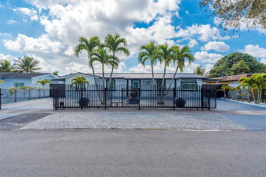 Beautiful lakefront residence located in a quiet and convenient Miami Gardens area, close to major highways, shopping centers, parks, and schools. This spacious home features 4 bedrooms and 3 bathrooms, plus a private in-law suite with independent entrance. Enjoy resort-style outdoor living with a heated saltwater pool with integrated jacuzzi and hydro-massage system, a fully equipped outdoor kitchen, and a deck overlooking the lake, perfect for relaxing or entertaining. The home has been thoughtfully upgraded, including impact windows throughout, a fully remodeled kitchen, and modernized bathrooms, offering comfort, style, and move-in-ready convenience. A great opportunity to own a lakefront property that combines privacy, tranquility, and proximity to everything.