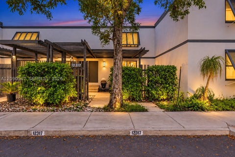 Photo of 12317 NW 11th St, Pembroke Pines, FL 33026 (MLS # A12090347)