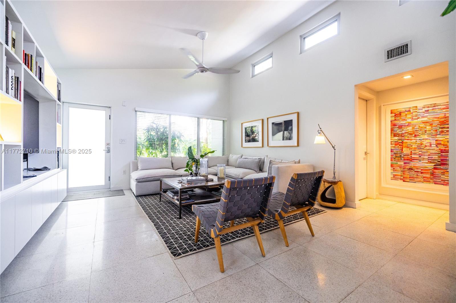 POOL home RETREAT! Experience living in TRUE MIAMI Mid-Century MODERN "Palm-Springs-style" Bungalow...nestled in Sherwood Forest...a slice of romance & history with peacocks and natural lush landscaping! Architectural classic features terrazzo floors, abounding in natural light w/oversized impact windows & vaulted high ceilings with tall clerestory windows...Amazing "GREAT VIBE" the minute you walk in! The entire house has been remodeled from top to bottom! Gorgeous large new kitchen overlooks the swimming pool and spacious entertaining + dining room. Both bedrooms are roomy, and the Primary bedroom offers a new bathroom ensuite w/walk-in closet. * Extra lounge space currently used as TV nook w/option for home office! A full 1-car garage w/finished ceiling and a laundry+closet area.