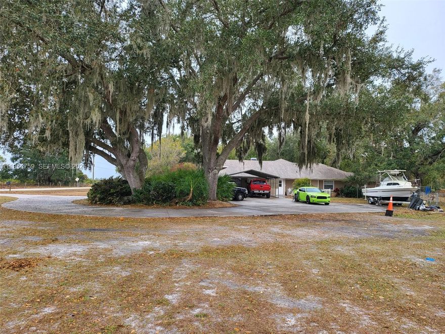 Best of Country Living at NW Oak Hill Avenue. 
Quiet serenity, abundant wild life (Turkey, Deer, Horses, and more). 
Roof & solar are just over five years old, well pump, water heater was recently replaced. 
2 HVAC units 1 is under 3 years old. 
Property was painted 5 years ago. 
House includes 4 bedrooms, (2X masters) 3 bathrooms, a large extra room. 
Built in entertainment area. 
Storage & loads of space for work-out machines (previous owner nicely converted the garage). Formal living room has a true wood-burning fireplace. 
Volume ceilings & French doors that take you from the living room to the family room, which has a nice bar. 
Entertainment space provides views of the paver patio nestled under the magnificent oak tree that separates the patio from the unobstructed pool area. Relax in the pool with complete privacy. 
Pool bath is easily accessed from the patio. 
The split floor plan allows for quiet sleep. 
Bedrooms have easy access to bathrooms. 
Fourth bedroom en-suite has outdoor access & could easily be a mother-in-law suite! 
Large eat-in kitchen countertop for all meals located off the mudroom & utility room lots of storage. House has 2 water heaters in the master and separate mother-in-law suite. Includes a safe room. 2023 Removable mesh pool fence for safety. Florida Room with built in bar area. 
5 car circular driveway. Endless possibilities. 
Large 3200 sq. ft. shop building with separate driveway & apron could add second floor.