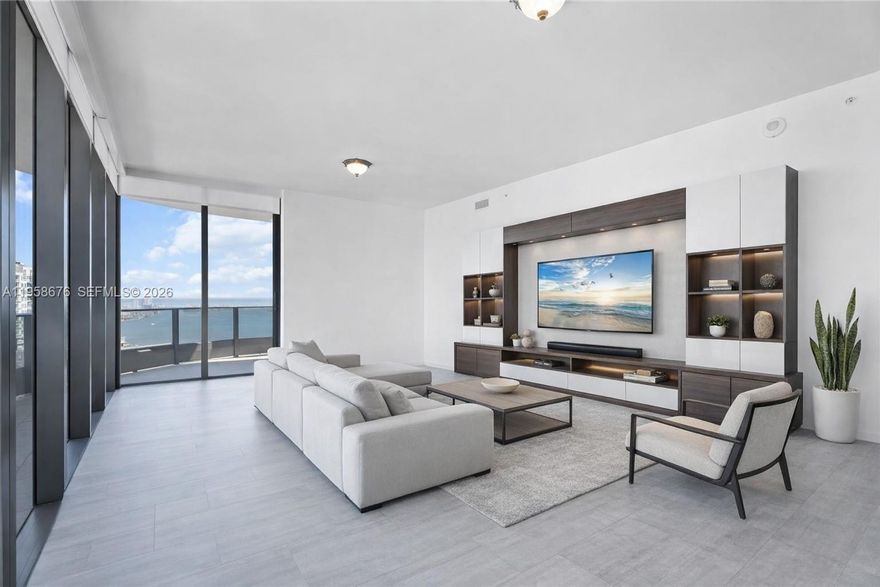 Welcome to Brickell Flatiron PH#5408 residence a 3bed/3.bath North East Corner Penthouse with breathtaking panoramic views of the water and Miami skyline from your expansive wrap around terrace. Features include: custom Italian Snaidero kitchen, Miele appliances, 10 ft floor to ceiling windows, electric blinds, porcelain wood tile throughout the condo with marble floors in the bathrooms, custom closets bedrooms and pantry. Additional features that set this Penthouse apart are two express destination elevators only available for the PH floors. 3 Parking spots (2 assigned + 1 valet.) Have access to resort style amenities including: 64th-Floor Rooftop Pool w/ Towel Service, Rooftop fitness center w/yoga & pilates, spa+steam room, sauna, lap Pool, children's Pool, theater, billiards room. Steps from world class restaurants and shopping including Brickell City Centre. Video Available upon request.