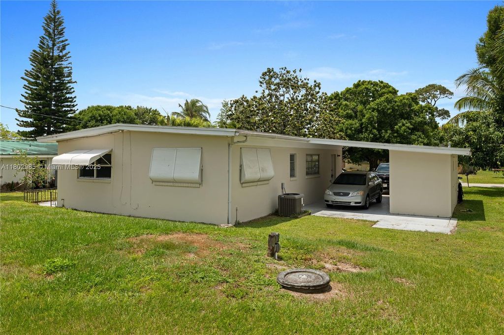 Photo of 409 Poplar Ave, Port St Lucie, FL 34952 (MLS # A11802985)