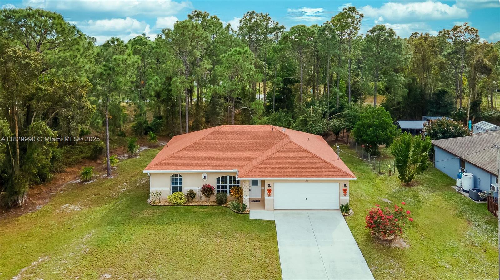 BEAUTIFUL 3 bed/ 3 bath/ 2 car garage, single family home built in 2003, Large back yard great for privacy and entertaining, conveniently located on a quiet street in Mirror lakes Lehigh acres, new roof 2022, New A/C (2022). Did You know that Lehigh has the highest elevation in lee County and That's the name come from? This Home in Not in a flood zone so NO FLOOD INSURANCE REQUIRED which will save you Hundreds per month! New Water filtration system.