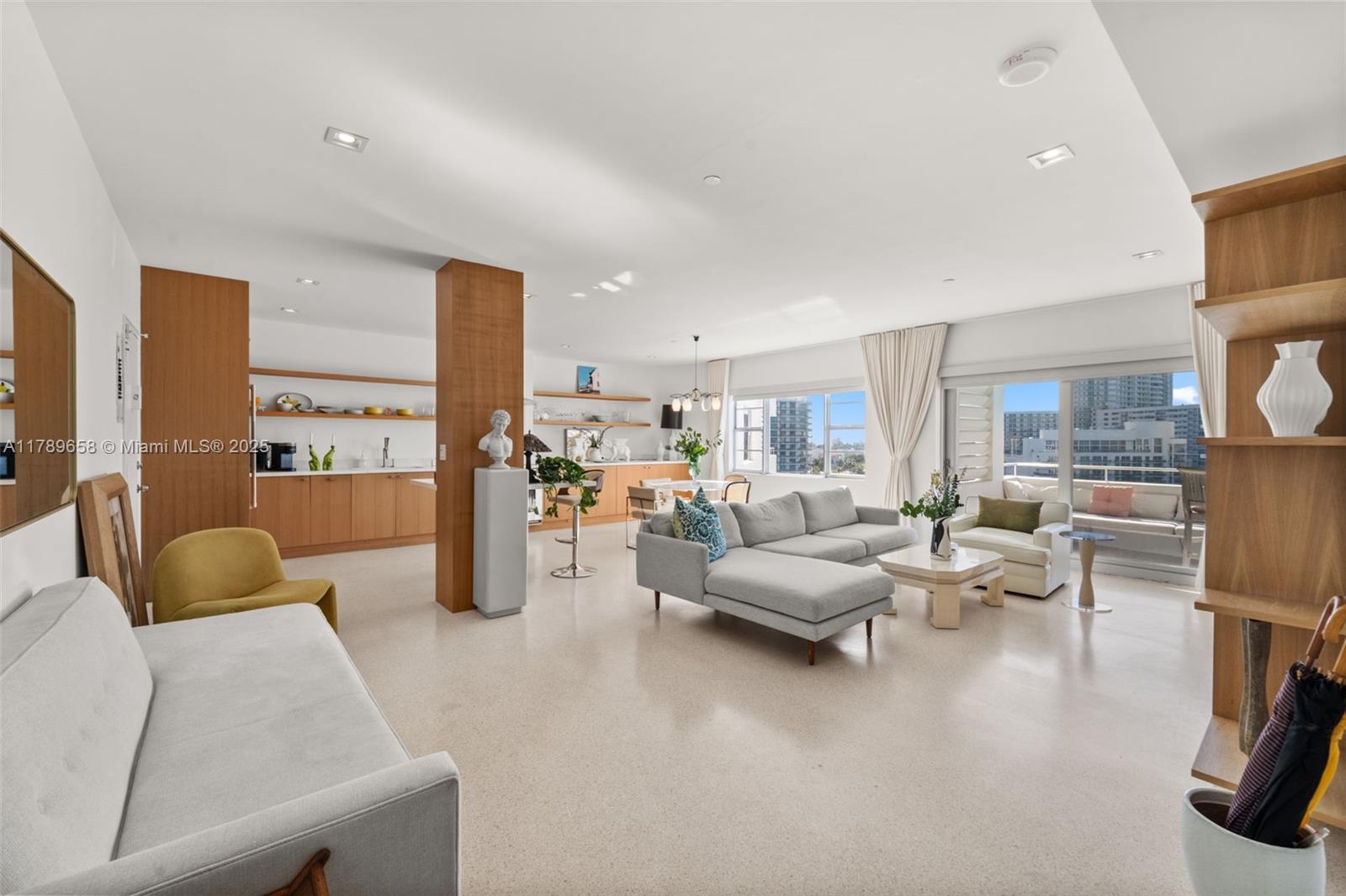 Most desirable rare F-line unit. A superb mid-century modern landmark on Belle Isle. Serene 46 unit building w/ open air lobby, turtle ponds, swimming pool, directly on Biscayne Bay, offering truly amazing water views. This Architectural Digest quality floor plan offers a huge master bedrooms plus 1.5 baths & generous closets. Completely renovated with designer gourmet kitchen. This unit also has new poured terrazzo floor thru out. Watch the cruise ships from your large terrace. Pet friendly/Dock available.