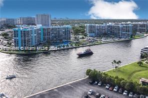Enjoy South Florida Living in style! Come see this 1800 square foot penthouse in The Hallmark. Two master suites with a full bath in each. Unit has large open living area with an updated kitchen. The view from the double wide balcony gives amazing views of the intracoastal and gorgeous sunsets nightly. This penthouse also has an additional room that can be converted to a third bedroom with a full bathroom of its own. Washer and dryer in the unit as well as two parking spaces in the newly remodeled attached parking garage. You can walk to the beach in minutes as well as shopping and restaurants. It is a wonderful location in Hollywood. The owner is also willing to offer a rent to own option for the right tenant. Please call listing agent for a showing.