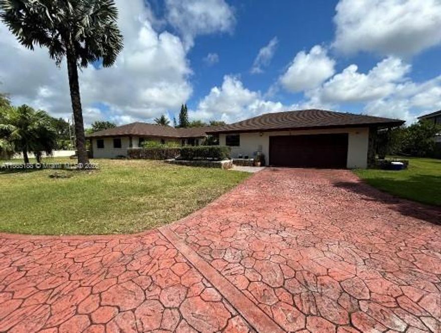 Spacious 4-bedroom, 3-bathroom home on a massive 35,501 sq. ft. lot with over 3,263 sq. ft. of living area and 4,667 sq. ft. total area. This property offers incredible potential with a 2-car garage and a new roof installed in 2023. The home features generous living spaces and a backyard designed for entertaining with a pool ready to be refinished and customized to your personal style.  Bring your boats and RV, Plenty of room for outdoor living, gardening, or expansion on the oversized lot. Located in a desirable Miami neighborhood, this property combines space, comfort, and opportunity, perfect for buyers looking to add their own touch and create a dream home.