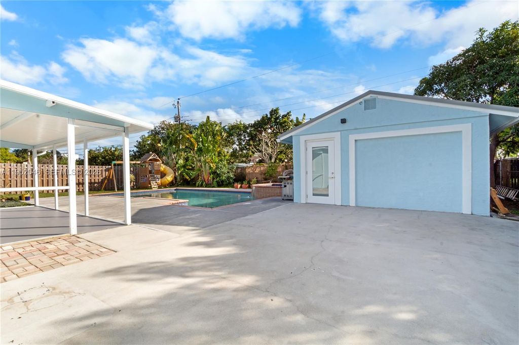 Photo of 230 NW 39th Ct, Deerfield Beach, FL 33064 (MLS # A11952046)