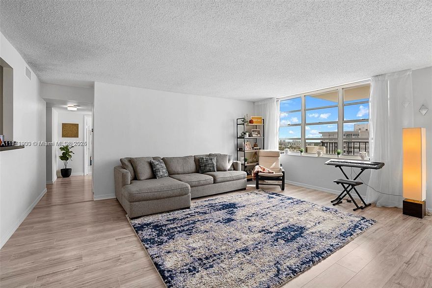 Come by to see this one of a kind unit on the 19th floor with water views. Updated bathrooms, kitchen, and new floor. Separate dining area in a room that could be used as a den, office or child play area. Plenty of natural light without the extra heat from the sun. As if that weren't enough, the building offers an array of amenities including a heated pool, tennis court, fully-equipped gym, and pool table, ensuring there's never a dull moment. Situated within walking distance to Aventura Mall, as well as a walking distance of restaurants, supermarkets, banks, and stores, convenience is at your fingertips.