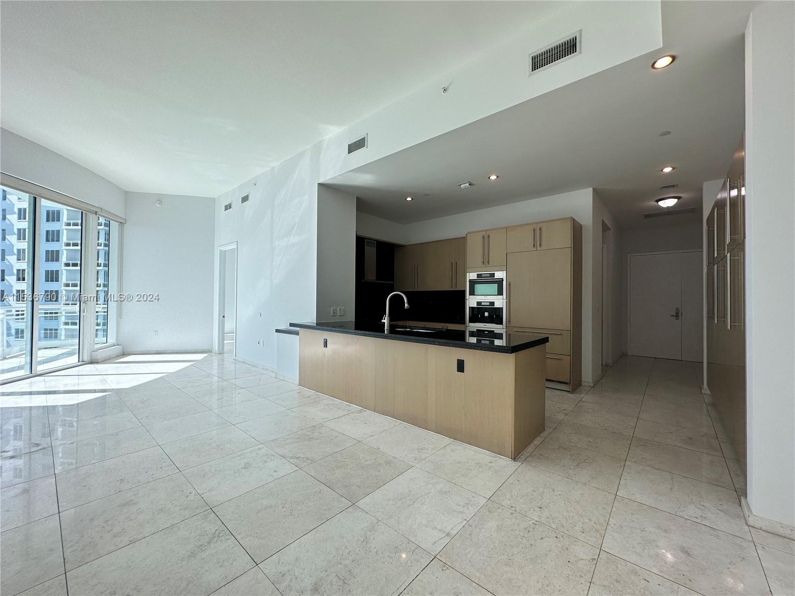 Magnificent bay front condo in Asia at Brickell Key offers 2 bedrooms, 2 1/2 baths, laid over 1,326 SqFt. Marble flooring through-out, 12 Ft ceilings, custom walk-in closets, expansive kitchen w/ Miele appliances. 2 parking spaces and storage unit included. Freshly painted. . Building amenities include: Tennis courts, pool, gym, sauna, steam room, basketball/racquetball court. Easy to show!