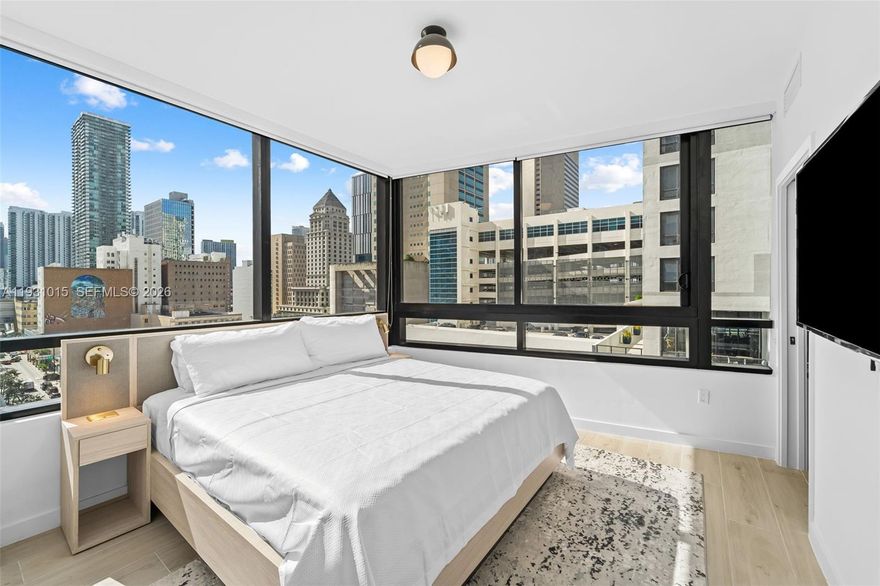 Beautiful 2 bedroom, 2 bathroom corner unit in District 225, Downtown Miami’s brand-new Airbnb-friendly building. This fully furnished residence offers abundant natural light and a bright, open layout. District 225 features a rooftop deck with a spa, fire pit, summer kitchen, and a resort-style pool with lounge and recreation room. Residents also enjoy a fitness center, basketball and racquetball courts, a rock climbing wall, co-working spaces, and a double-height lobby. The building provides 24/7 security, valet and self-parking, an on-site café, electric bikes with charging stations, and optional housekeeping services.