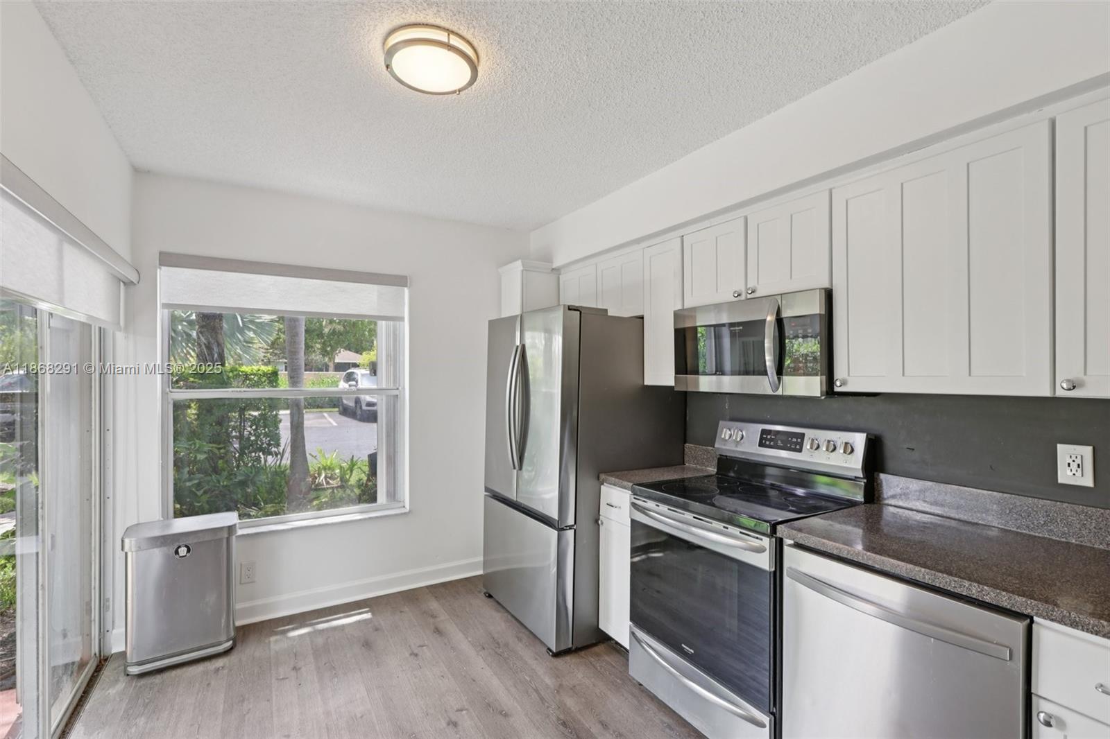Nestled in a charming quiet gated community, this townhome graces the lakefront's edge. Just a 1-minute stroll to peace and joy, where you can unwind and savor nature or enjoy a leisurely walk. Your home features a 1-car garage, a parking spot in front, and extra guest parking in the community. It’s a stunningly updated 3-bed, 2.5-bath townhome with a convenient half bath downstairs. The home is equipped with a new kitchen and appliances, modern bathrooms, fresh floors, and shutters for hurricane safety. This is the ideal home for small families, first-time buyers, or investors seeking reliable rental income. Owners Can Immediately rent upon purchase. FHA and VA buyers are welcome.