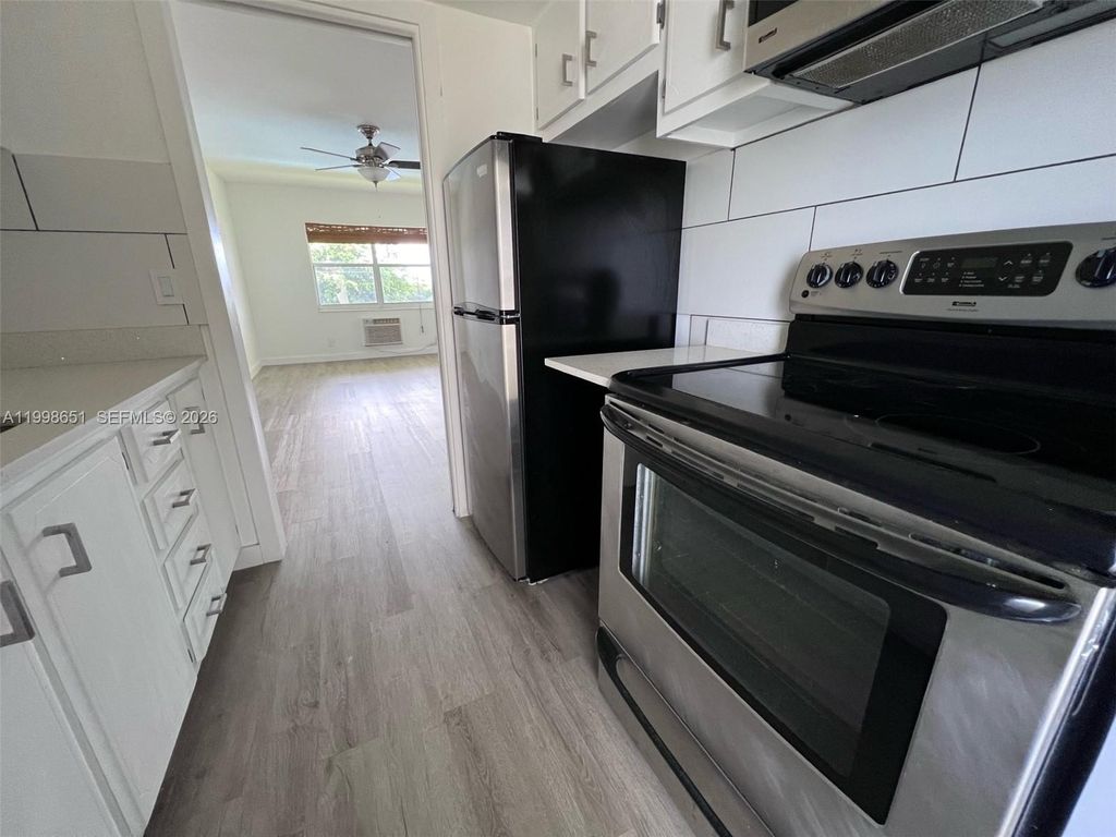 Photo of 1350 E Sample Rd #306, Pompano Beach, FL 33064 (MLS # A11998651)