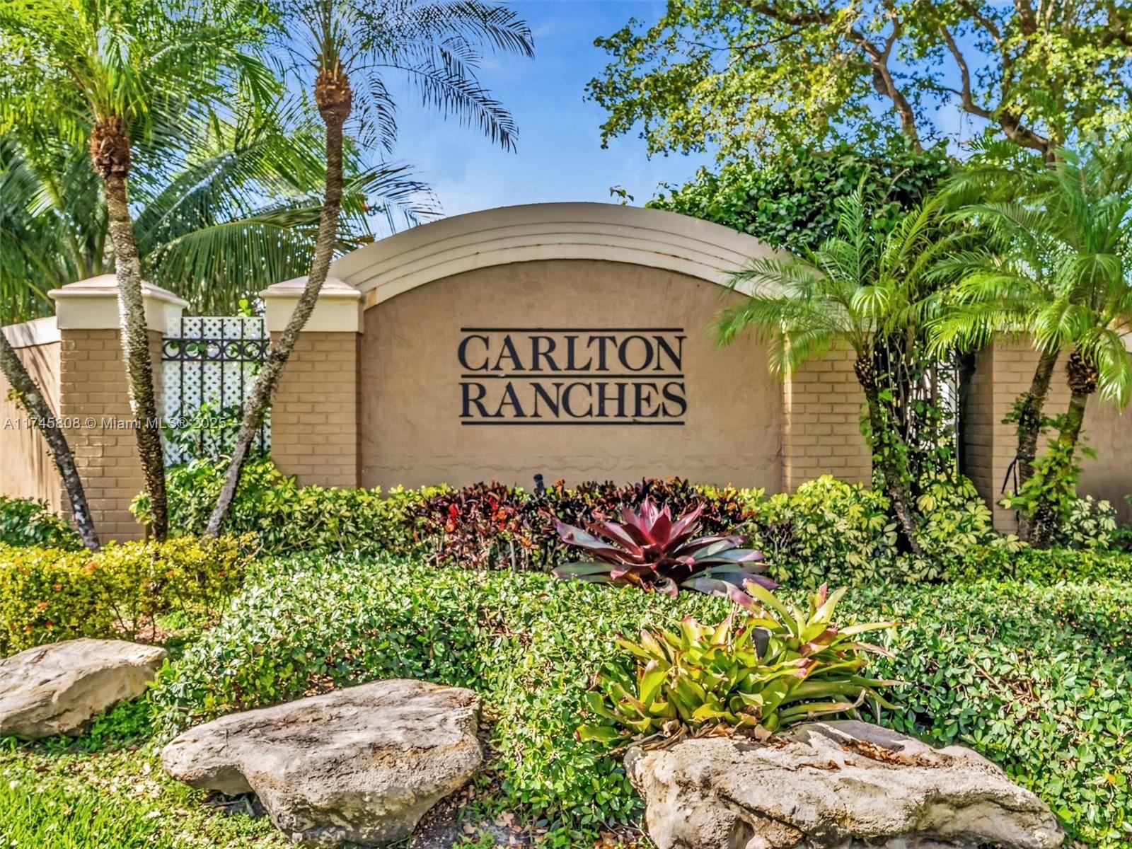 Welcome home to stunning resort-style living! Experience a world of elegance and comfort in this fantastic 5-bedroom, 3-bathroom home, with a cozy den or formal dining room in a gated Davie community. This property sits on a spacious builder's acre and features a newer roof. The bedrooms are adorned with cherry parquet floors, while the fabulous spa boasts beautiful travertine tiles and a soothing waterfall feature. Two bedrooms are conveniently located on the ground floor. If you enjoy cooking, the inviting kitchen will delight any chef. Charming plantation shutters and a stunning mature garden. The fenced-in pool, outdoor mini kitchen, and cozy fireplace make this space perfect for entertaining friends and family while enjoying breathtaking lake vistas. “Rented until September 14, 2025”.