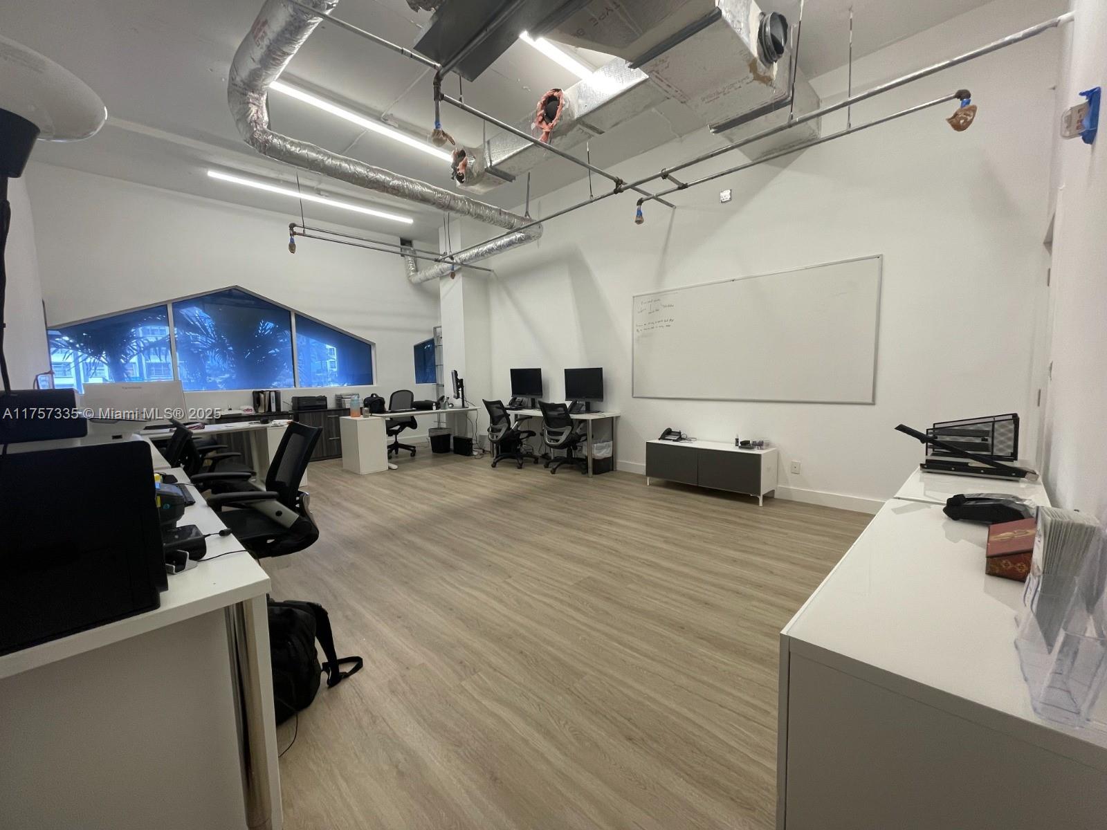 Newly renovated 1007sqft office with two separate offices, break room with a kitchen and an enclosed waiting/reception area in a beautiful and secure residential condominium in Miami Beach! Located on the mezzanine floor next door to building's gym and down the hall from the pool with access to the beach. This space is sure to impress your clients and/or customers. 16 foot ceilings and Internet ready. Can be sold fully furnished or unfurnished. New floors, new doors, every 4 feet electric and cable, brand new AC unit just installed recently. Move in Ready!