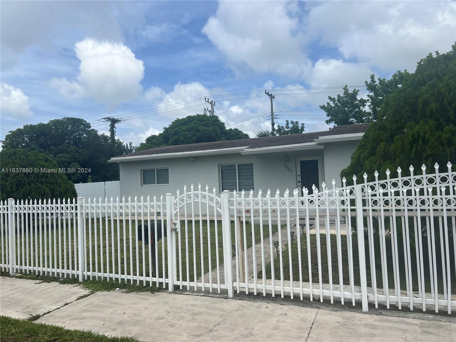 Spectacular CORNER Single-Family home in the heart of Miami-Gardens .Step into a world or warmth and comfort as you enter the open concept living space with natural light that is perfect for entertaining. All remodeled! Indulge in your fully updated kitchen featuring quartz countertops and stainless steel appliances. Both bathrooms have been remodeled. New porcelain floors throughout. Updated PVC pipelines. Beautiful COVERED AND TILED TERRACE, the backyard have plenty space for pool. The corner lot is all around fenced for better privacy and the backyard. Very well located a few blocks from the Palmetto Expressway. JUST COME AND SEE IT!!
