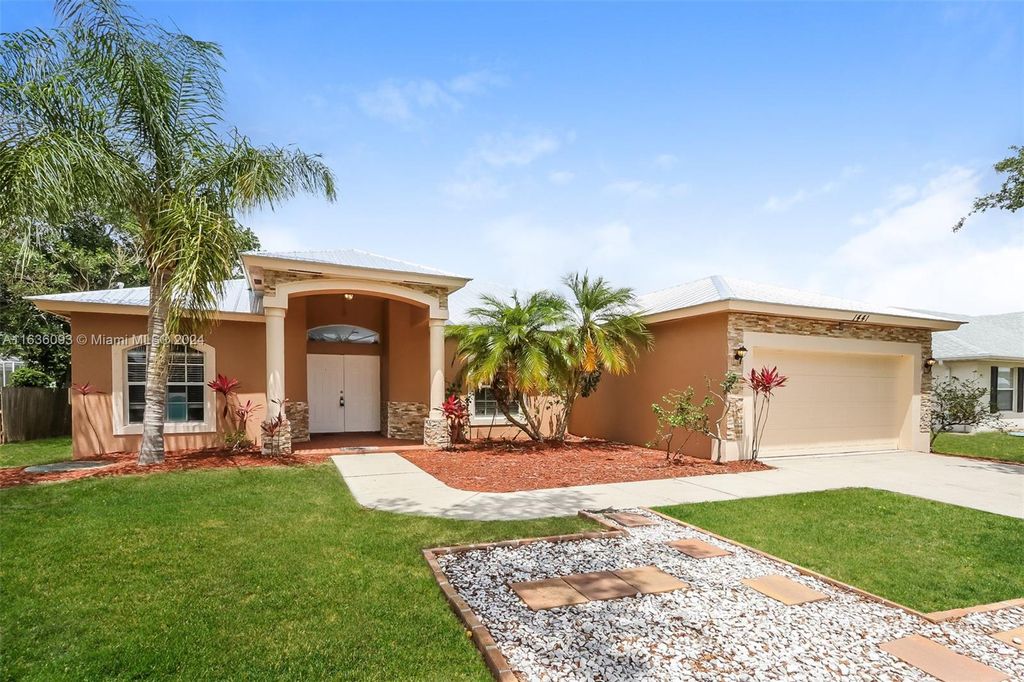 Photo of 1441 SW Flounder Ln, Port Saint Lucie, FL 34953 (MLS # A11636093)