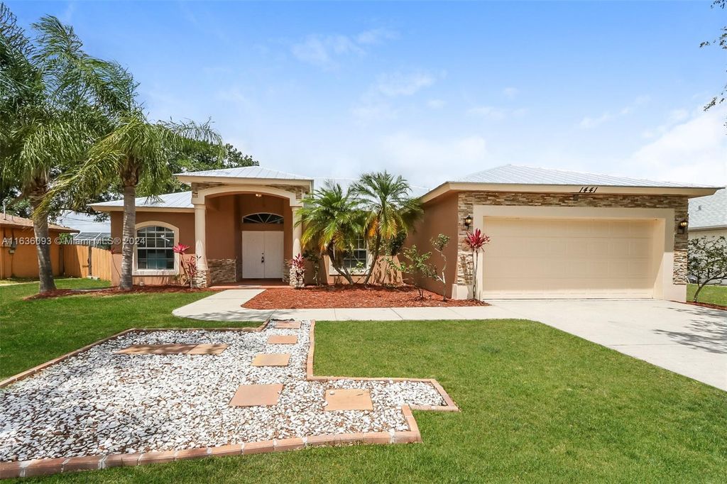 Photo of 1441 SW Flounder Ln, Port Saint Lucie, FL 34953 (MLS # A11636093)