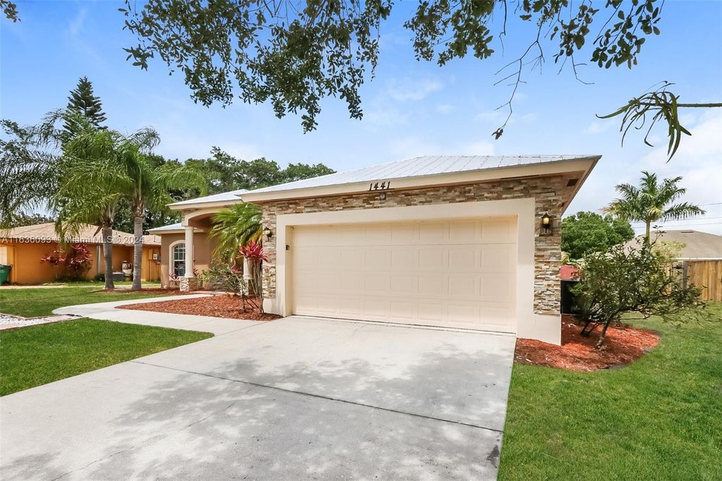 Photo of 1441 SW Flounder Ln, Port Saint Lucie, FL 34953 (MLS # A11636093)