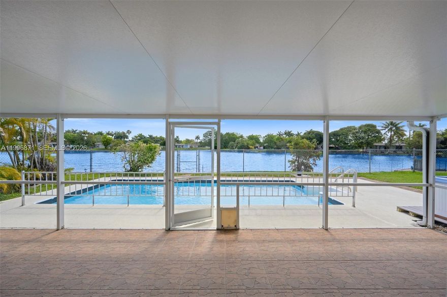 STUNNING WATERFRONT LIVING. This beautifully maintained 2-bedroom, 2-bath pool home sits on a wide canal, offering peaceful views and a true connection with nature. Spacious Florida room provides additional living space with direct views of the water. The gourmet kitchen has been thoughtfully updated with quartz countertops, custom backsplash, stainless steel appliances, a gas stove, and ample cabinetry.
Enjoy your private backyard oasis featuring a covered and screened patio, an open pool area, and a fully fenced yard—ideal for both relaxation and entertaining! 

Travertine flooring throughout
Hurricane impact windows and doors
Air-conditioned 1-car garage with hurricane-rated door
Generator included for added peace of mind 
Recent updates include roof (2019) and A/C (2020).

Centrally located near shopping, dining, and major conveniences. Perfect for your family!