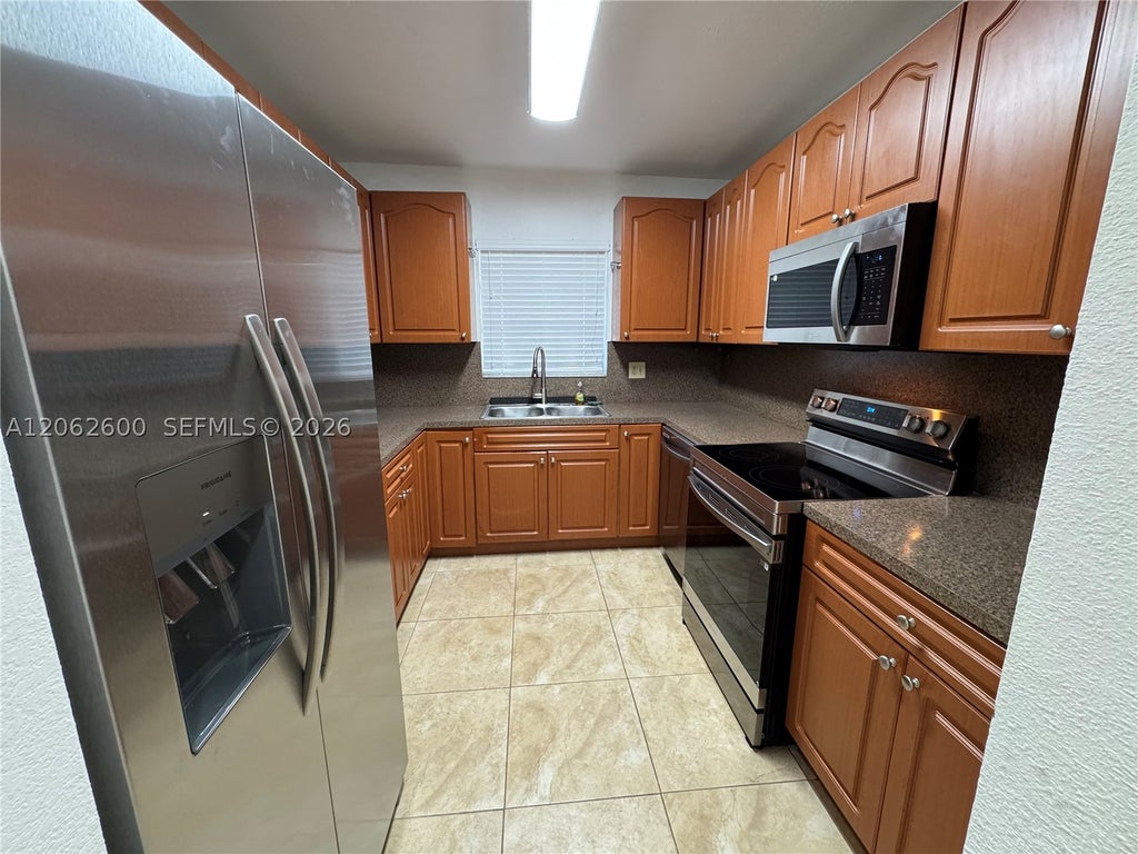 Photo of 717 NE 10th Ave #1-2, Hallandale Beach, FL 33009 (MLS # A12062600)