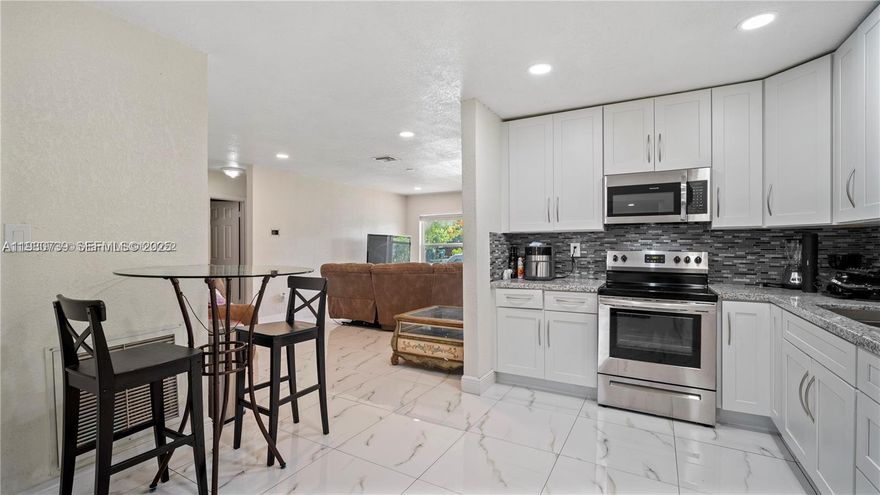 Well maintained 1 story townhouse/3-Bedroom, 2Bath- OVER 1350 SQFT! Miami Gardens. Property boasts recent renovations, including a new roof, impact windows, new plumbing, updated kitchen with new stainless-steel appliances, white cabinetry, and granite countertops. Inviting open floor plan with recess lighting, marble porcelain floors, and vinyl wood floors in bedrooms. Remodeled bathrooms with modernized fixtures. It's convenient location is close to the Hard Rock Stadium (home of the Miami Dolphins, Miami Hurricanes and host of concerts and major events). Also located near Calder Racetrack, local restaurants, new shopping centers, and major expressways Palmetto (826) & Turnpike. This property is move in ready! Easy to show! Call now to schedule.