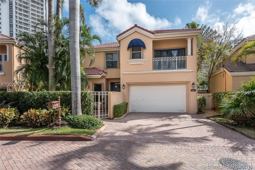 Exquisitely appointed luxury home in the private, gated community of Island Way in the City of Aventura. This home has been used sparingly as a pied-a-terre.  Enter through the private gated courtyard onto the foyer and living areas. Manicured private gardens and walled pool/patio area. Top of the line kitchen cabinets, generously sized rooms, tall ceilings, top of the line finishes, lots of natural light. Master bedroom offers an adjoining sitting room within master suite. Accordion shutters.