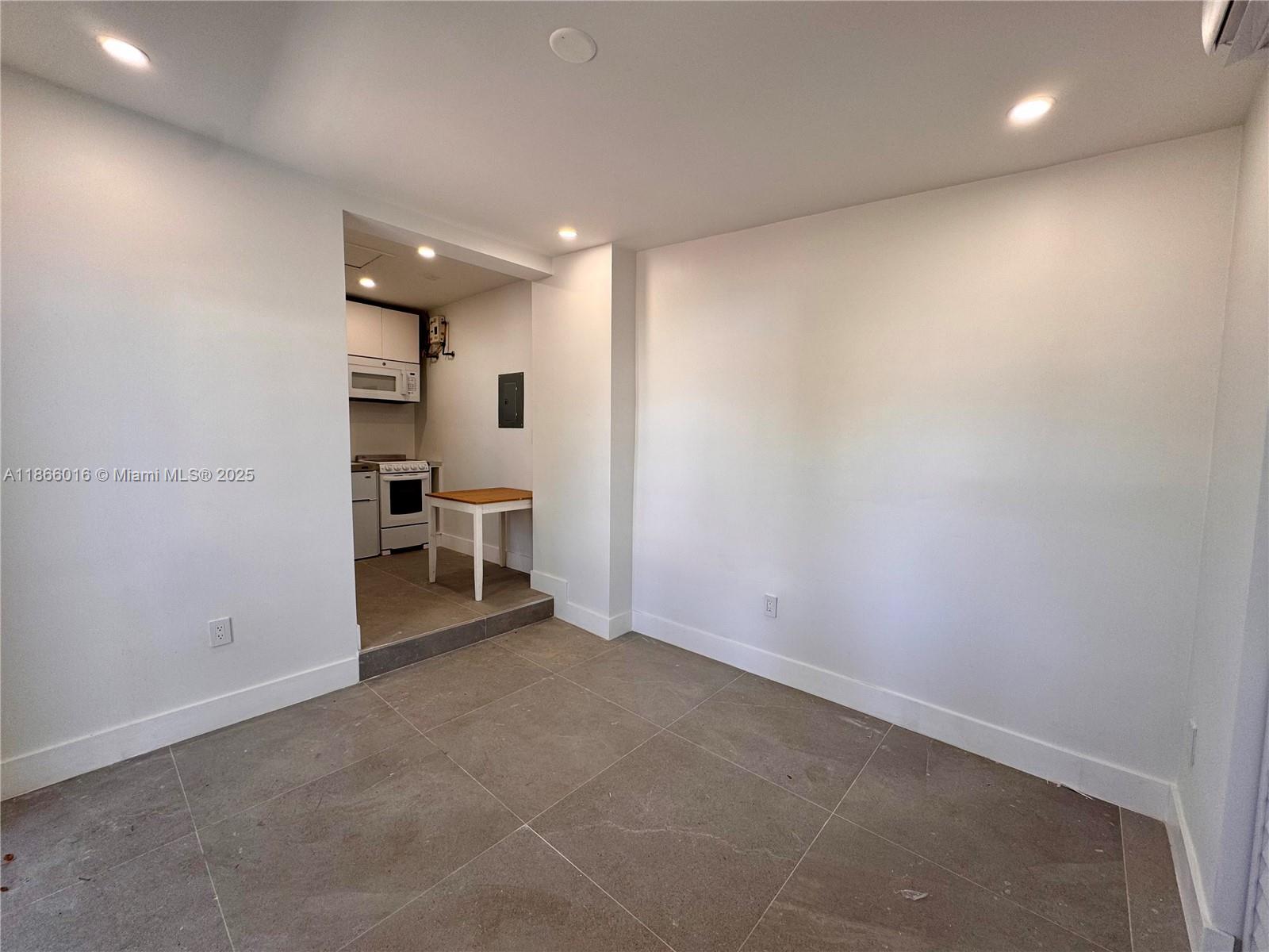 Discover your newly remodeled studio efficiency! This light filled modern space features sleek tile floors and a full bathroom with a glass shower. Enjoy the convenience of a reach-in closet with built-ins and a fully equipped kitchen offering a brand new oven, stovetop, refrigerator, microwave, and a/c mini-split. The property is fenced with a spacious front yard, perfect for outdoor relaxation. Rent includes electric, water, and high-speed fiber optic internet, making this an ideal, all-inclusive home option. Don't miss out on this charming and convenient living space— located within walking distance of public transportation, a new Target, Sprouts, Coconut Grove and Coral Gables.