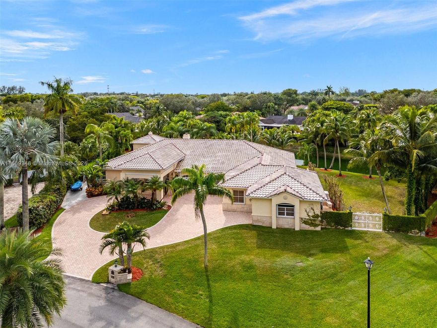 Welcome to your perfect retreat in the desirable Galloway Glen neighborhood. This stunning property is situated on a generous 27,878 SF lot on a quiet cul de sac.The home offers a spacious floor plan designed for comfort and style with high ceilings, formal living room with fireplace, dining room, large family room, eat in kitchen, and a 3 car garage, with a workshop room.This canal front home features a beautiful, and tranquil backyard oasis complete with outdoor kitchen, bath, pool/spa, and large covered patio area, ideal for entertaining or relaxing with family and friends. 
Situated in a prime location, the property offers 24/7 roaming security patrol, and easy access to top-rated schools, hospitals, parks, vibrant shopping and dining options making it the ideal property to call home.