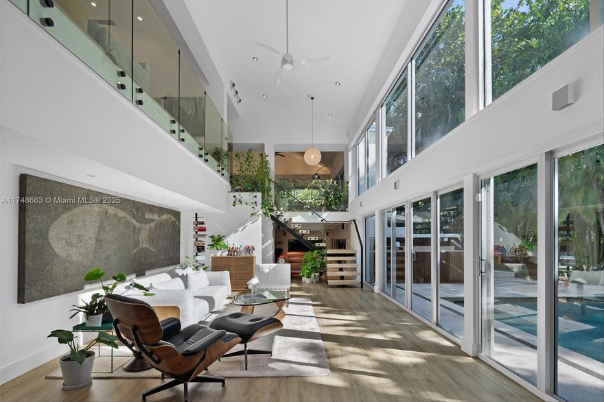 A ONE-OF-A-KIND PRIVATE SANCTUARY! This architectural masterpiece is a statement of exclusivity and sophistication. With the prestige of a Coral Gables address and the serene charm of Coconut Grove, this home offers unparalleled privacy and a truly unique design, making it unlike anything else on the area. Originally conceived by the visionary Hilario Candela, it is a seamless blend of modern elegance and bold architectural expression. Surrounded by mature trees and lush greenery in an oversized lot, every level of the home is shielded from view, ensuring absolute discretion and tranquility. A perimeter security system with cameras and an anti-paparazzi fence elevates this property into a true private enclave.
