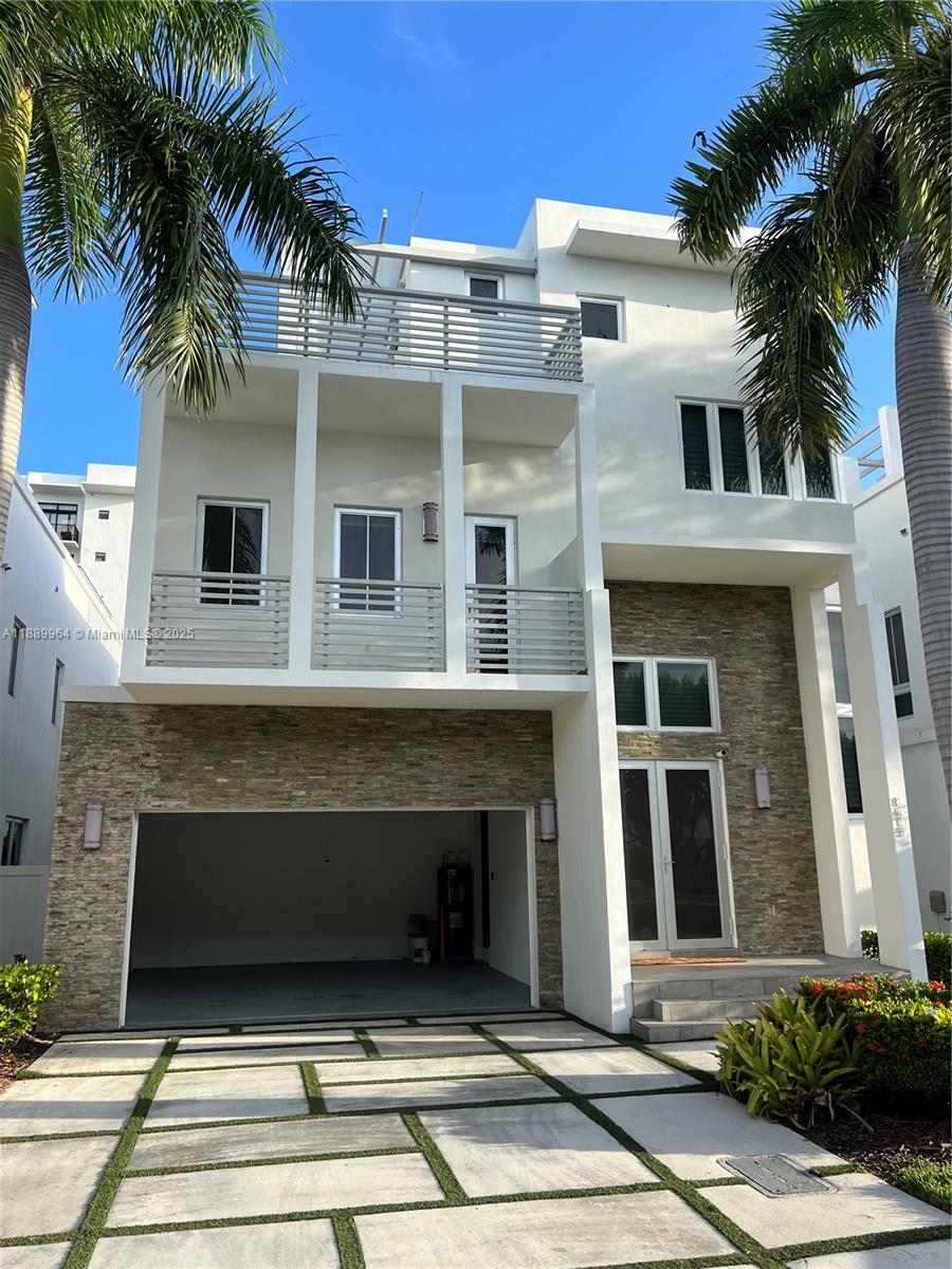 The luxurious and smart home in Oasis Square Park features contemporary three-story architecture and includes 5 beds and 5 full baths. The entire house has marble floors and high ceilings,Italian kitchen with a quartz island is equipped with Wolf brand SS appliances and a wine cellar . Pool and a covered terrace with a jacuzzi. The master bedroom is spacious, with a large walking closet,a bathroom with a bathtub, and automated blinds. Prime location, near City Place, Downtown Doral, & important access routes such as the Palmetto Expressway and the Dolphin Expressway, facilitating travel to other areas of Miami and surroundings. 15 minutes from the airport and close to the Downtown Doral, which hosts a variety of shops, gourmet restaurants, cafes, and entertainment options