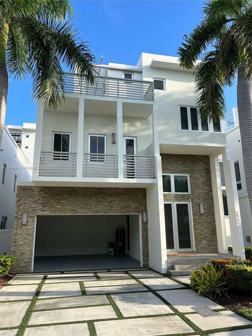 The luxurious and smart home in Oasis Square Park features contemporary three-story architecture and includes 5 beds and 5 full baths. The entire house has marble floors and high ceilings,Italian kitchen with a quartz island is equipped with Wolf brand SS appliances and a wine cellar . Pool and a covered terrace with a jacuzzi. The master bedroom is spacious, with a large walking closet,a bathroom with a bathtub, and automated blinds. Prime location, near City Place, Downtown Doral, & important access routes such as the Palmetto Expressway and the Dolphin Expressway, facilitating travel to other areas of Miami and surroundings. 15 minutes from the airport and close to the Downtown Doral, which hosts a variety of shops, gourmet restaurants, cafes, and entertainment options