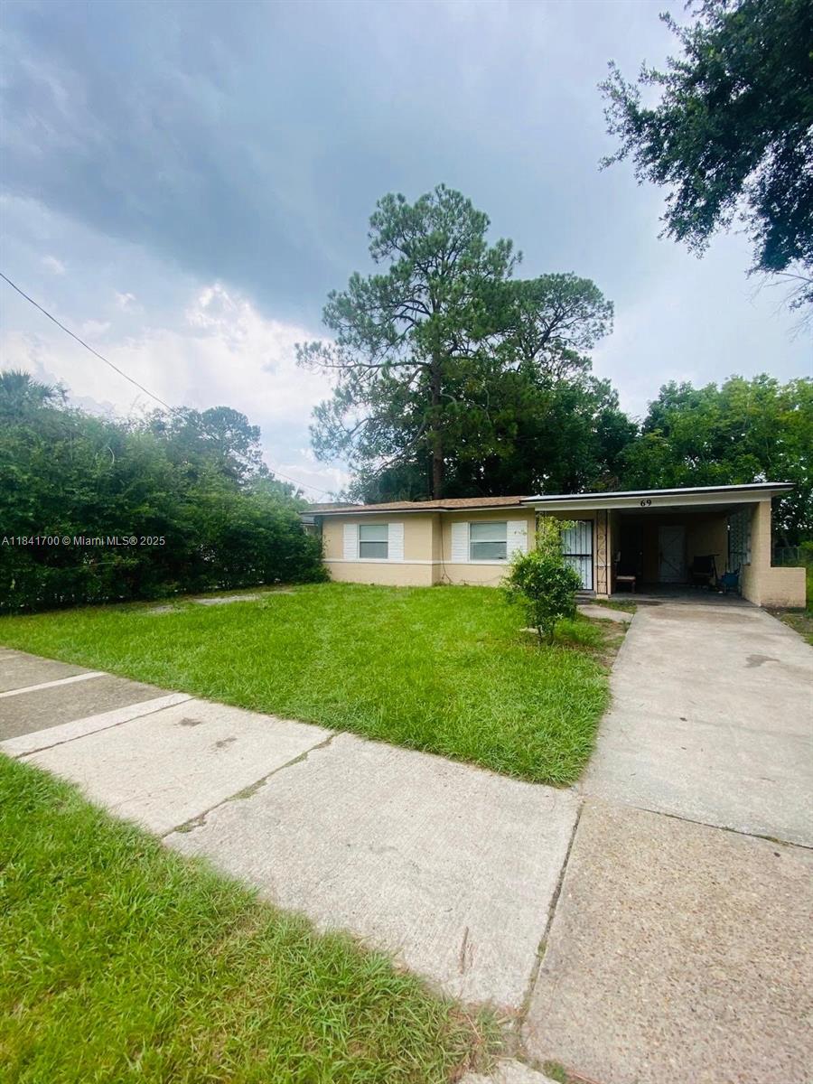 Investor Opportunity! Tenant-occupied home in Jacksonville. Great investment opportunity featuring a 2-bed 1-bath concrete block home with shingle roof and stable tenant in place. This charming single-story property sits on a spacious lot with mature trees and a fenced yard, providing both privacy and potential for exterior upgrades. Inside features tile flooring throughout and a functionally updated kitchen with white cabinetry and appliances. Both bedrooms offer natural light, window A/C units, and easy-to-maintain flooring. The bathroom includes a full-size tub/shower combo, updated vanity, and neutral finishes. With plenty of yard space and close proximity to local parks and schools, this home is a great buy-and-hold rental or an affordable starter with room for cosmetic improvements.