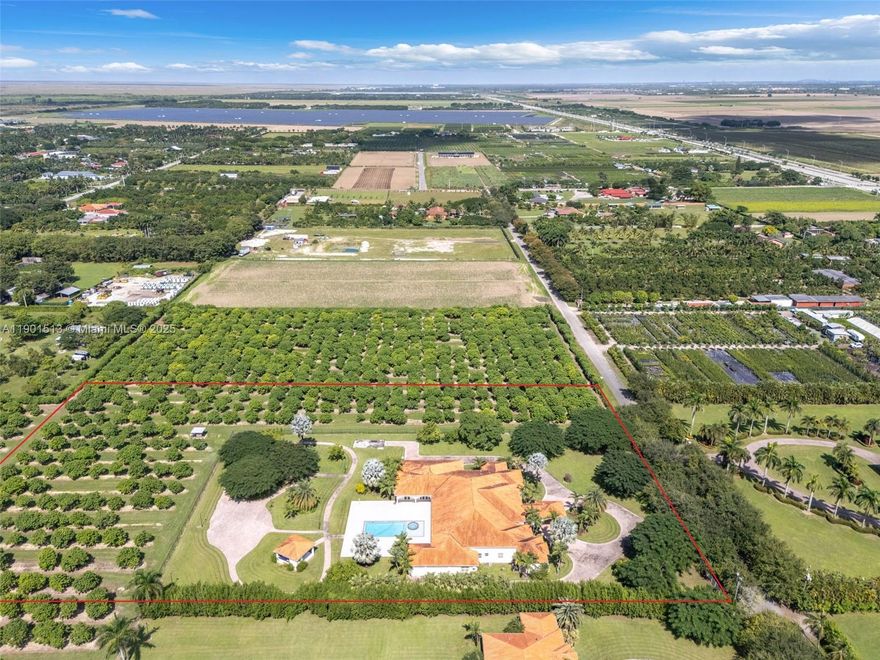 HIGH END GEN X ESTATE ON 5 ACRES. A LUXURIOUS COMPOUND WITH OVER 13,000 SQ FT UNDER ROOF & 11K+ UNDER AIR. A WALL OF GLASS ALLOWS FOR DIRECT VIEWS OF THE RESORT LEVEL GROUNDS TO INC: VERANDAS/ OPEN PATIO/ HEATED POOL(8 FOOTER)/SPA /SUMMER KITCHEN W BATH AND WELL LIT PATHWAYS THRUOUT THE GROUNDS. THE LIVING AREA , A GREAT ROOM,HAS 20'+ CEILINGS, AN OVERSIZED KITCHEN THAT CAN SUPPORT LARGE OR SMALL EVENTS. AN AMAZING FORESIGHT IN THE DESIGN WITH ITS OVERSIZED LIVING AREA. EACH WING CAN PRIVATELY SUPPORT A FAMILY, ITS A TRUE SPLIT FLOOR PLAN.  EACH HAS A MAIN SUITE/MULTI OFFICES, BEDS /BATHS /LAUNDRY /GARAGE IT ALLOWS FOR MAX USAGE OF SPACE. WRAPPED ON 2 SIDES WITH INCOME LYCEE GROVES. THIS IS ONE OF A KIND A MUST SEE..ENJOY THE PEACE AND SERENITY OF THIS LOCATION & LIFESTYLE..