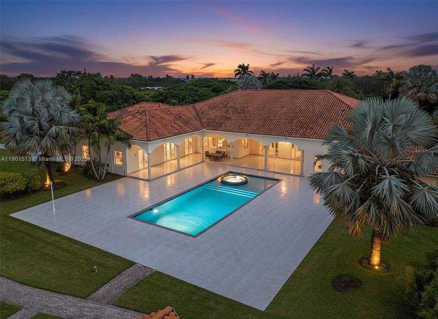 GEN X ESTATE ON 5 ACRES. A LUXURIOUS COMPOUND WITH OVER 13,000 SQ FT UNDER ROOF & 11K+ UNDER AIR. A WALL OF GLASS ALLOWS FOR DIRECT VIEWS OF THE RESORT LEVEL GROUNDS TO INC: VERANDAS/ OPEN PATIO/ HEATED POOL(8 FOOTER)/SPA /SUMMER KITCHEN W BATH AND WELL LIT PATHWAYS THRUOUT THE GROUNDS. THE LIVING AREA , A GREAT ROOM,HAS 20'+ CEILINGS, AN OVERSIZED KITCHEN THAT CAN SUPPORT LARGE OR SMALL EVENTS. AN AMAZING FORESIGHT IN THE DESIGN WITH ITS OVERSIZED LIVING AREA. EACH WING CAN PRIVATELY SUPPORT A FAMILY, ITS A TRUE SPLIT FLOOR PLAN.  EACH HAS A MAIN SUITE/MULTI OFFICES, BEDS /BATHS /LAUNDRY /GARAGE IT ALLOWS FOR MAX USAGE OF SPACE. WRAPPED ON 2 SIDES WITH INCOME LYCEE GROVES. THIS IS ONE OF A KIND A MUST SEE..ENJOY THE PEACE AND SERENITY OF THIS LOCATION & LIFESTYLE..