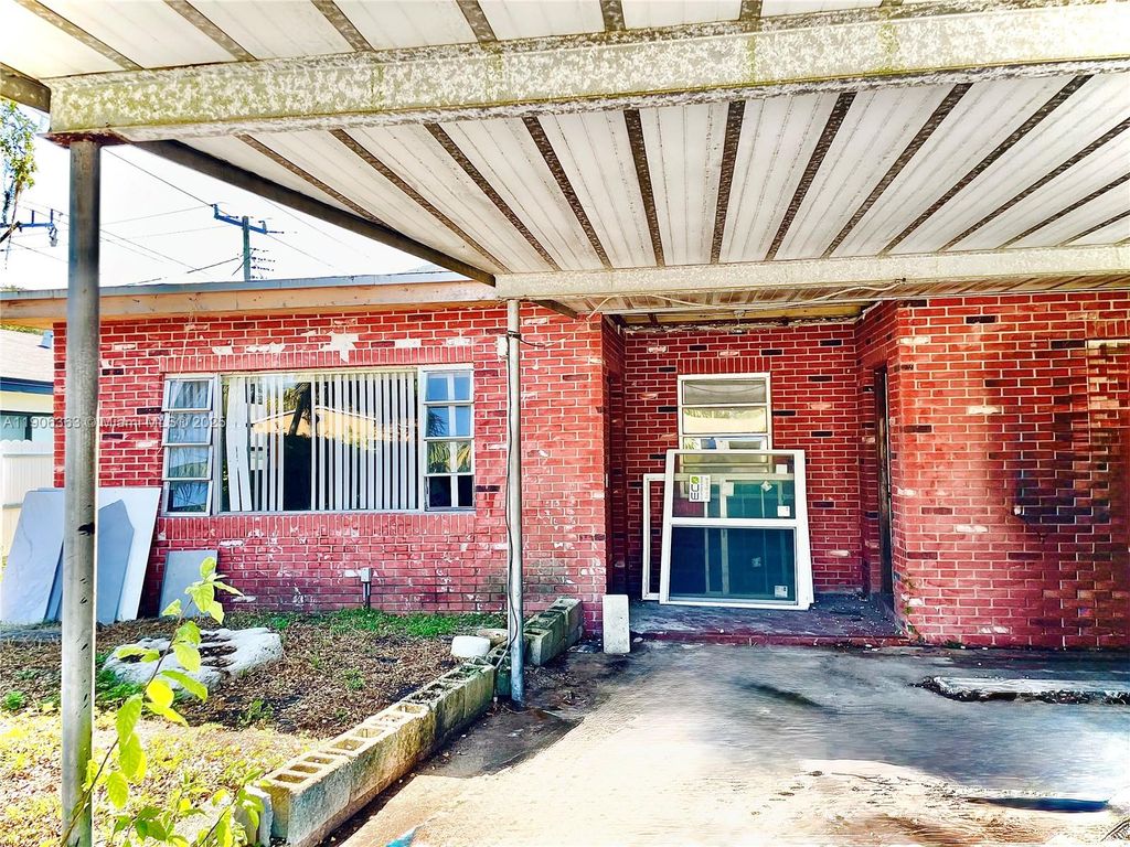 Photo of 1590 NE 153rd Ter, North Miami Beach, FL 33162 (MLS # A11906363)