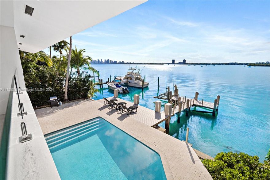 This stunning waterfront estate offers sweeping open bay views, located in the gated community of North Bay Island. The residence features 4 bedrooms, 4 bathrooms, and a den that can be used as a fifth bedroom. The spacious floor plan includes an open kitchen, two living areas, and a large master suite with a jacuzzi and a private terrace. The tropical backyard is equipped with a sparkling pool and plenty of entertainment space, making it perfect for gatherings or relaxation. Boating enthusiasts will love the 70-foot dock, perfect for a 45' boat. This magnificent home offers unparalleled waterfront living and is situated close to top-rated schools, luxury shopping, and the city's finest dining.