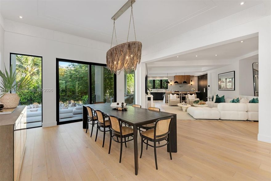 Located just moments from the beach & boardwalk, this contemporary waterfront oasis offers utmost resort style living.  Enjoy refined coastal living on an oversized 25,850 SF lot with 237 FT of waterfrontage. The open chef’s kitchen boasts marble book-matched countertops, handcrafted tiles & full prep pantry. This estate is ideal for entertaining w/ expansive open living areas, 150 sf wine cellar, sprawling circular driveway, a 47-foot heated saltwater pool, summer kitchen & lush tropical landscaping. This home features 2 luxurious primary suites, gym, 2 car garage & Control 4 system. Private roof deck awaits w/ beautiful water views & summer kitchen w/grill. Enjoy tranquil luxury living just a short walk from Miami Beach’s top restaurants & beach clubs!